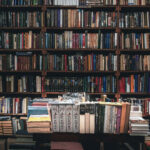 Floor to ceiling book shelf full of books